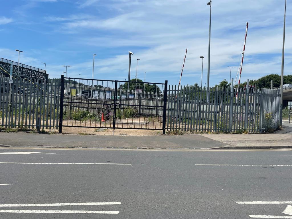Lot: 99 - LAND WITH RESIDENTIAL PLANNING FOR 33 UNITS - Front of site with gated access and fencing